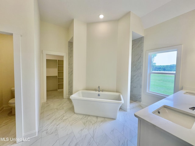 full bathroom with vanity, independent shower and bath, and toilet