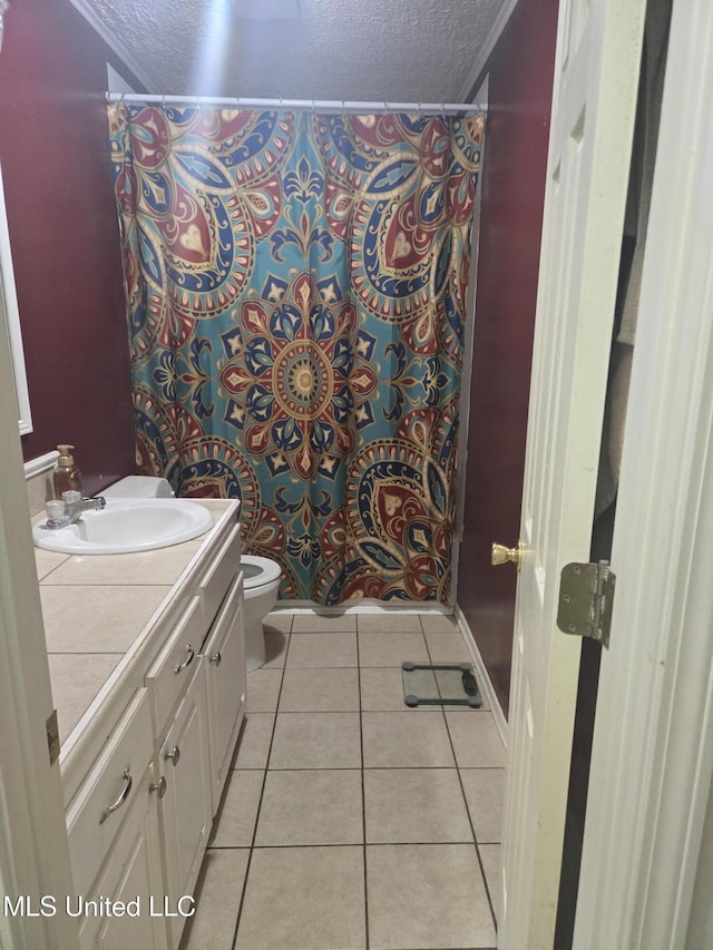full bath featuring a textured ceiling, tile patterned flooring, toilet, vanity, and curtained shower