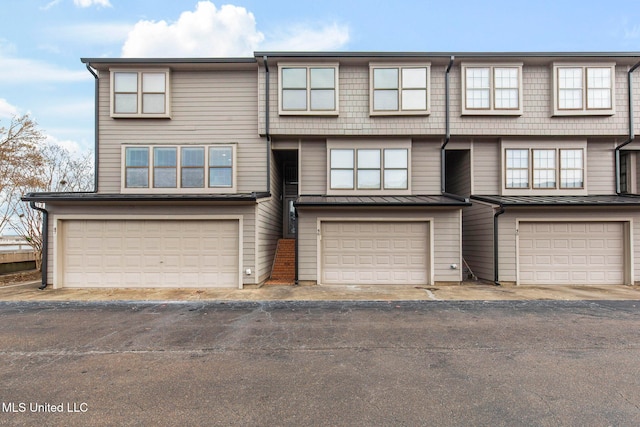 view of property featuring an attached garage