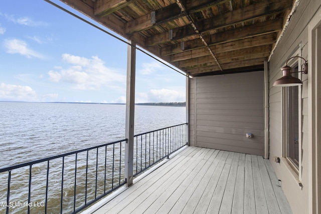 wooden deck with a water view