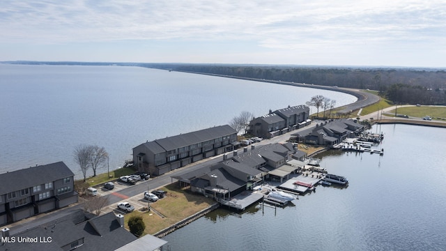 birds eye view of property featuring a water view and a residential view