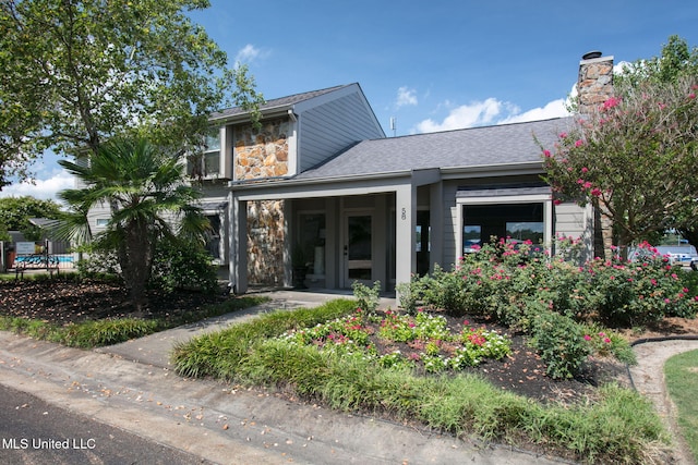 view of front of home with a chimney