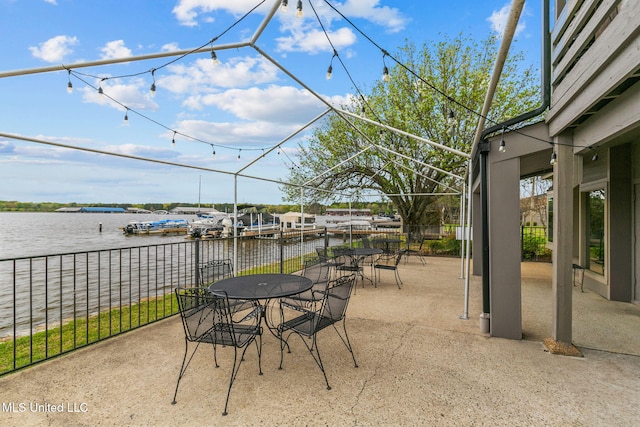 view of patio / terrace featuring outdoor dining area and a water view