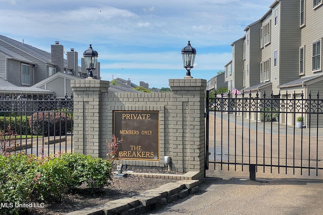 view of gate featuring fence