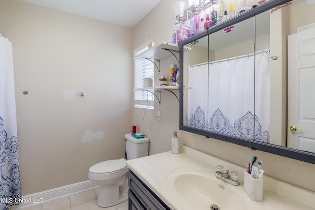 8412 Kaleki Pl, Diamondhead, MS 39525 - bathroom featuring tile patterned floors, toilet, baseboards, and vanity