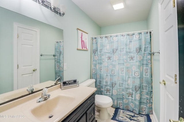 8412 Kaleki Pl, Diamondhead, MS 39525 - bathroom featuring toilet, vanity, and a shower with curtain