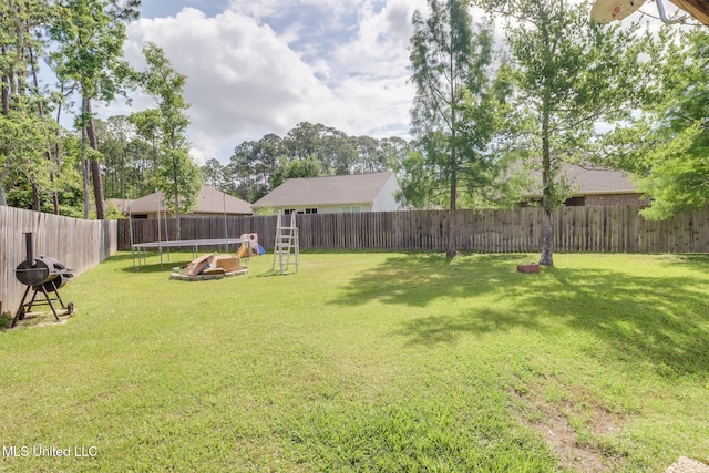 8412 Kaleki Pl, Diamondhead, MS 39525 - view of yard featuring a trampoline