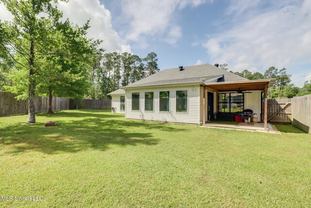 8412 Kaleki Pl, Diamondhead, MS 39525 - back of house featuring a patio, a ceiling fan, and a shingled roof