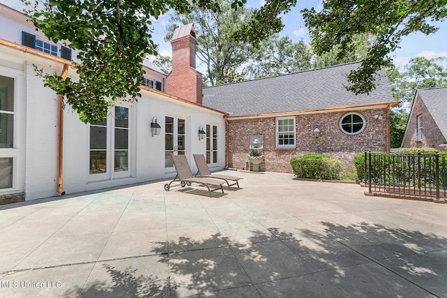 back of house with a patio