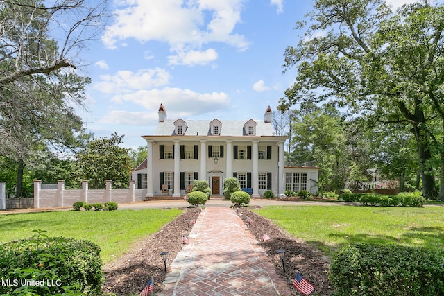 view of front of house featuring a front yard and a porch