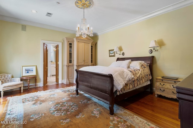 bedroom featuring ornamental molding, a chandelier, and dark hardwood / wood-style flooring