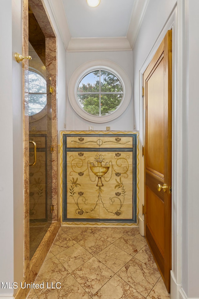 doorway to outside featuring crown molding