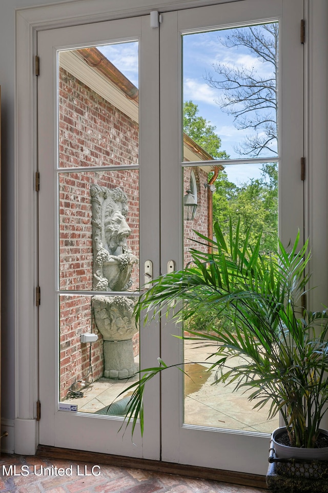 doorway to outside featuring french doors and a wealth of natural light