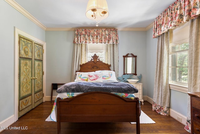 bedroom featuring crown molding and dark hardwood / wood-style floors