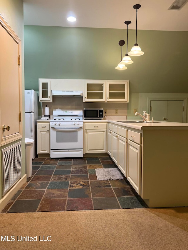 kitchen featuring sink, white cabinetry, hanging light fixtures, and white appliances