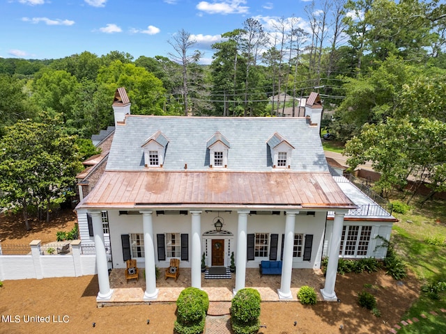 view of front of property featuring a patio area and french doors