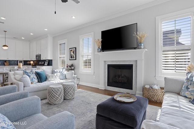 122 Aiken Rd, Waveland, MS 39576 - living area with recessed lighting, baseboards, wood finished floors, and ornamental molding