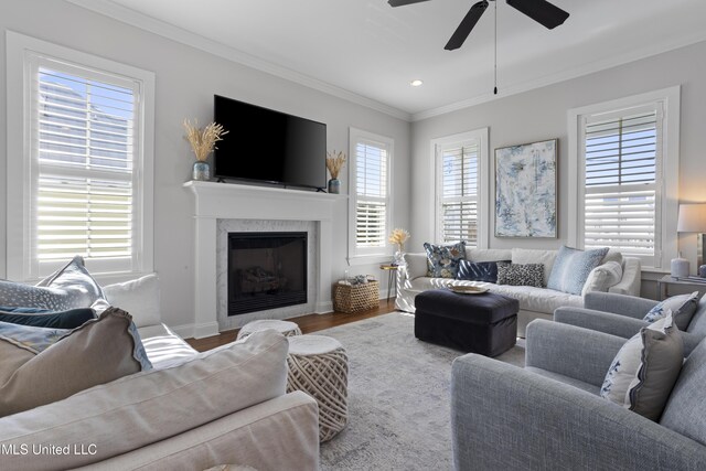 122 Aiken Rd, Waveland, MS 39576 - living area with crown molding, plenty of natural light, wood finished floors, and a high end fireplace