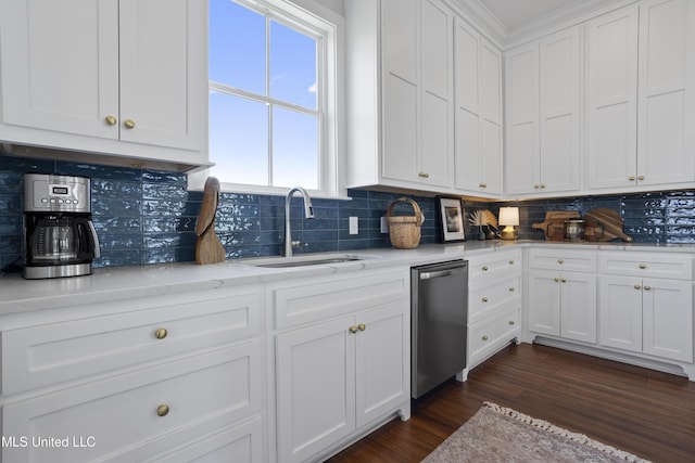 122 Aiken Rd, Waveland, MS 39576 - kitchen featuring backsplash, dark wood-style flooring, a sink, white cabinetry, and stainless steel dishwasher