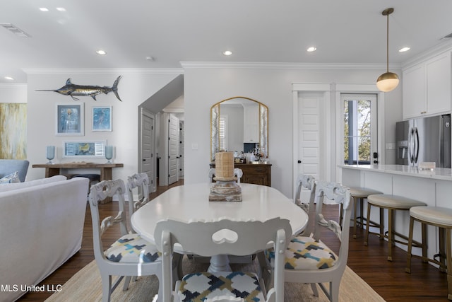 122 Aiken Rd, Waveland, MS 39576 - dining area with dark wood finished floors, recessed lighting, visible vents, and ornamental molding