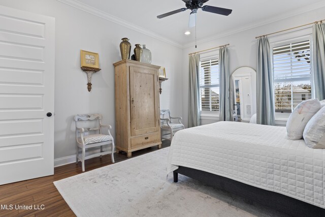 122 Aiken Rd, Waveland, MS 39576 - bedroom featuring dark wood finished floors, a ceiling fan, baseboards, and ornamental molding
