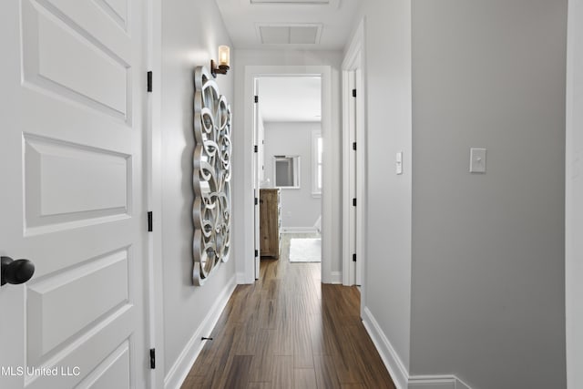 122 Aiken Rd, Waveland, MS 39576 - hallway featuring visible vents, baseboards, and dark wood-type flooring