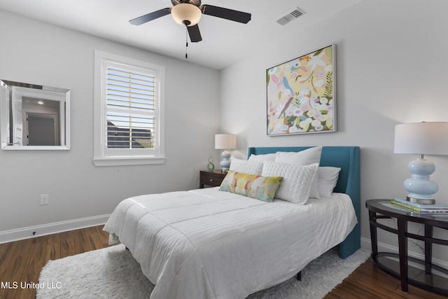 122 Aiken Rd, Waveland, MS 39576 - bedroom featuring visible vents, baseboards, wood finished floors, and a ceiling fan