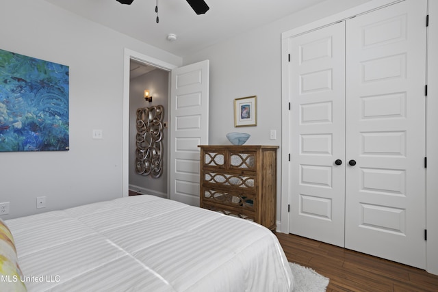 122 Aiken Rd, Waveland, MS 39576 - bedroom featuring a closet, ceiling fan, and dark wood-style flooring