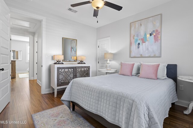 122 Aiken Rd, Waveland, MS 39576 - bedroom with visible vents, baseboards, and wood finished floors