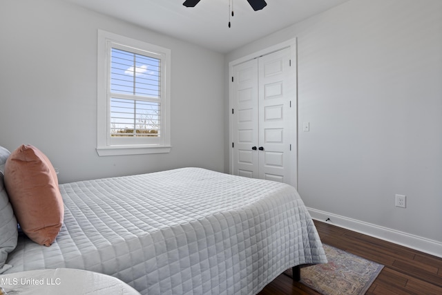 122 Aiken Rd, Waveland, MS 39576 - bedroom with ceiling fan, a closet, baseboards, and wood finished floors