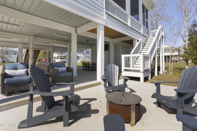 122 Aiken Rd, Waveland, MS 39576 - view of patio / terrace featuring stairway and outdoor dining area