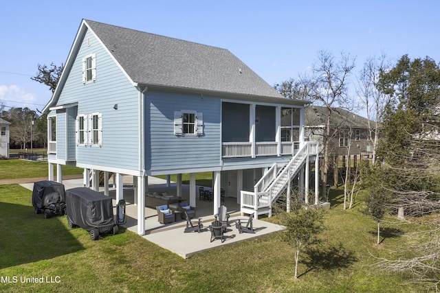 122 Aiken Rd, Waveland, MS 39576 - back of property with stairway, a yard, a sunroom, a shingled roof, and a patio area