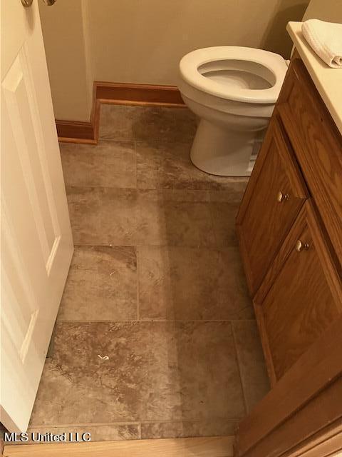 bathroom with toilet and vanity