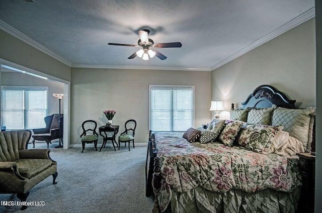 bedroom featuring ceiling fan, a textured ceiling, carpet, and ornamental molding