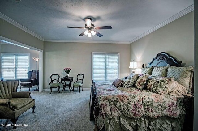 carpeted bedroom featuring crown molding, ceiling fan, and baseboards