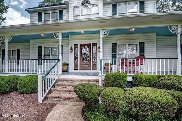 entrance to property with covered porch