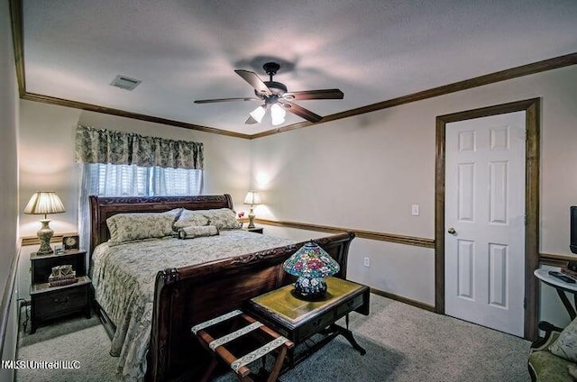 carpeted bedroom with crown molding, visible vents, ceiling fan, and baseboards