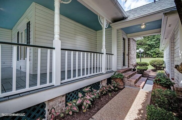 view of side of property with a porch