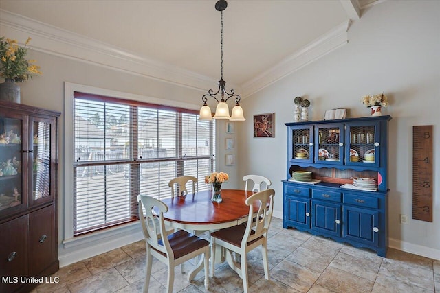 dining area with crown molding and baseboards