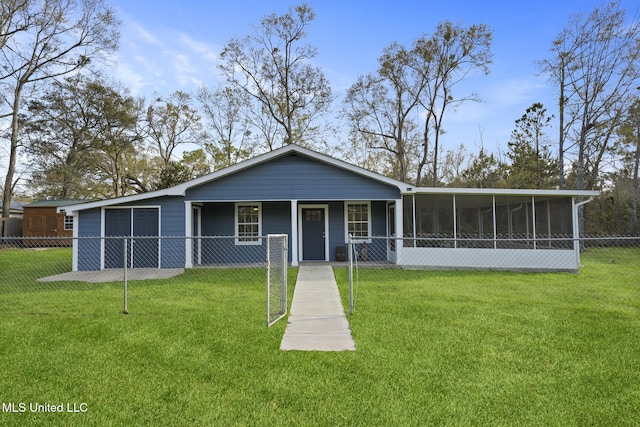 view of front facade with a front yard and a sunroom