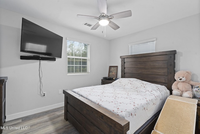 bedroom featuring ceiling fan and dark hardwood / wood-style floors