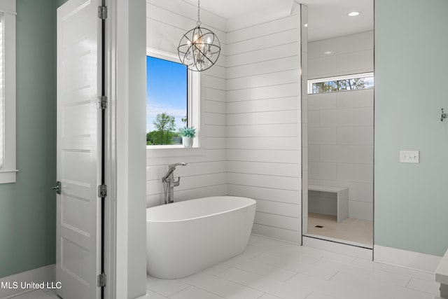 bathroom featuring shower with separate bathtub, tile patterned flooring, and a wealth of natural light