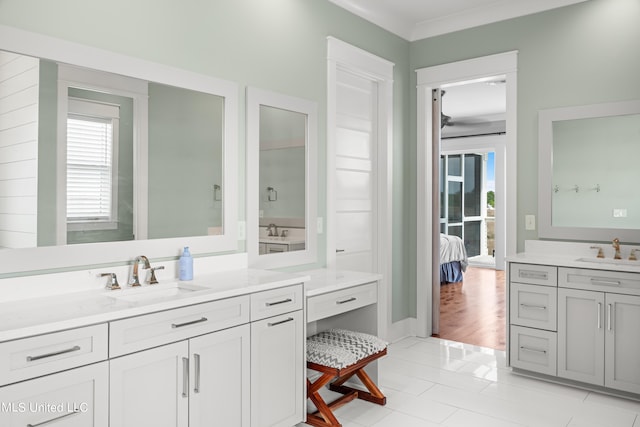 bathroom featuring vanity, ornamental molding, and tile patterned flooring