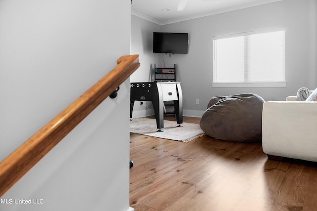 interior space featuring ornamental molding and hardwood / wood-style floors