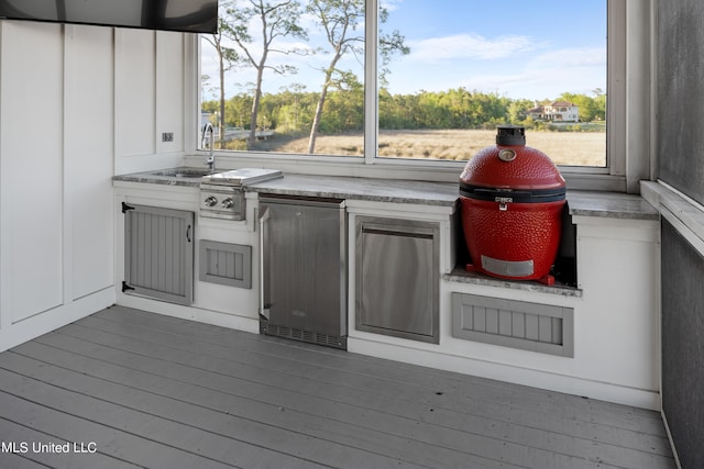 wooden deck featuring sink