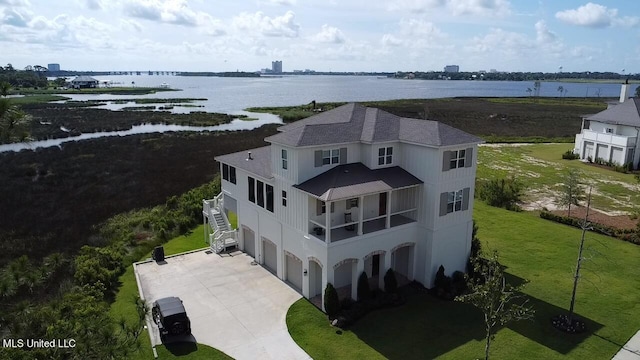 drone / aerial view with a water view