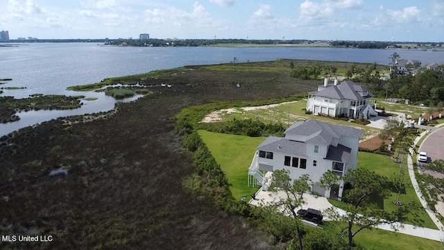 birds eye view of property with a water view