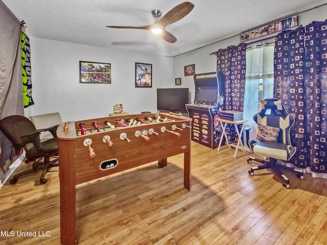 11295 Peyton Dr, Gulfport, MS 39503 - rec room featuring a ceiling fan, wood finished floors, and a textured ceiling