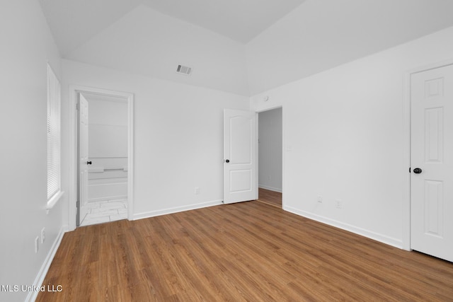 unfurnished bedroom with baseboards, visible vents, and wood finished floors
