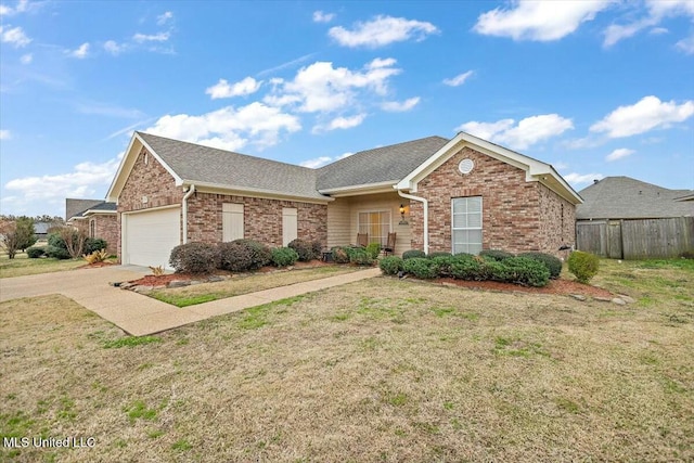 ranch-style house with driveway, an attached garage, fence, a front lawn, and brick siding